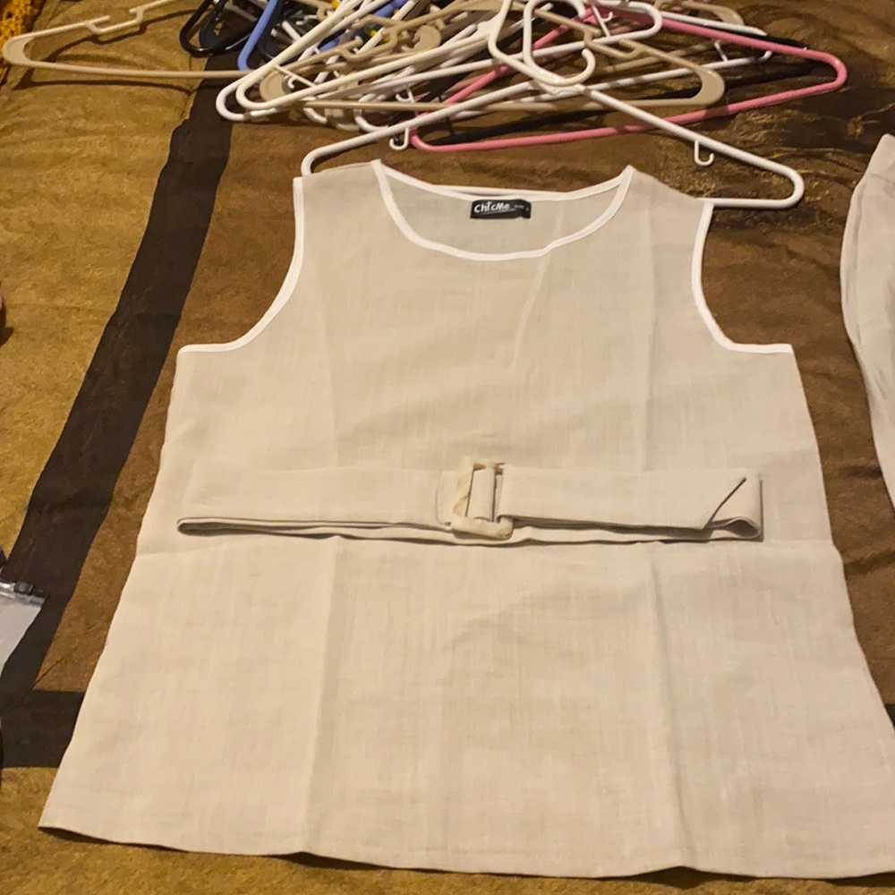 Beige summer pant suit. Sleeveless top and bell bottom pants. Never worn.